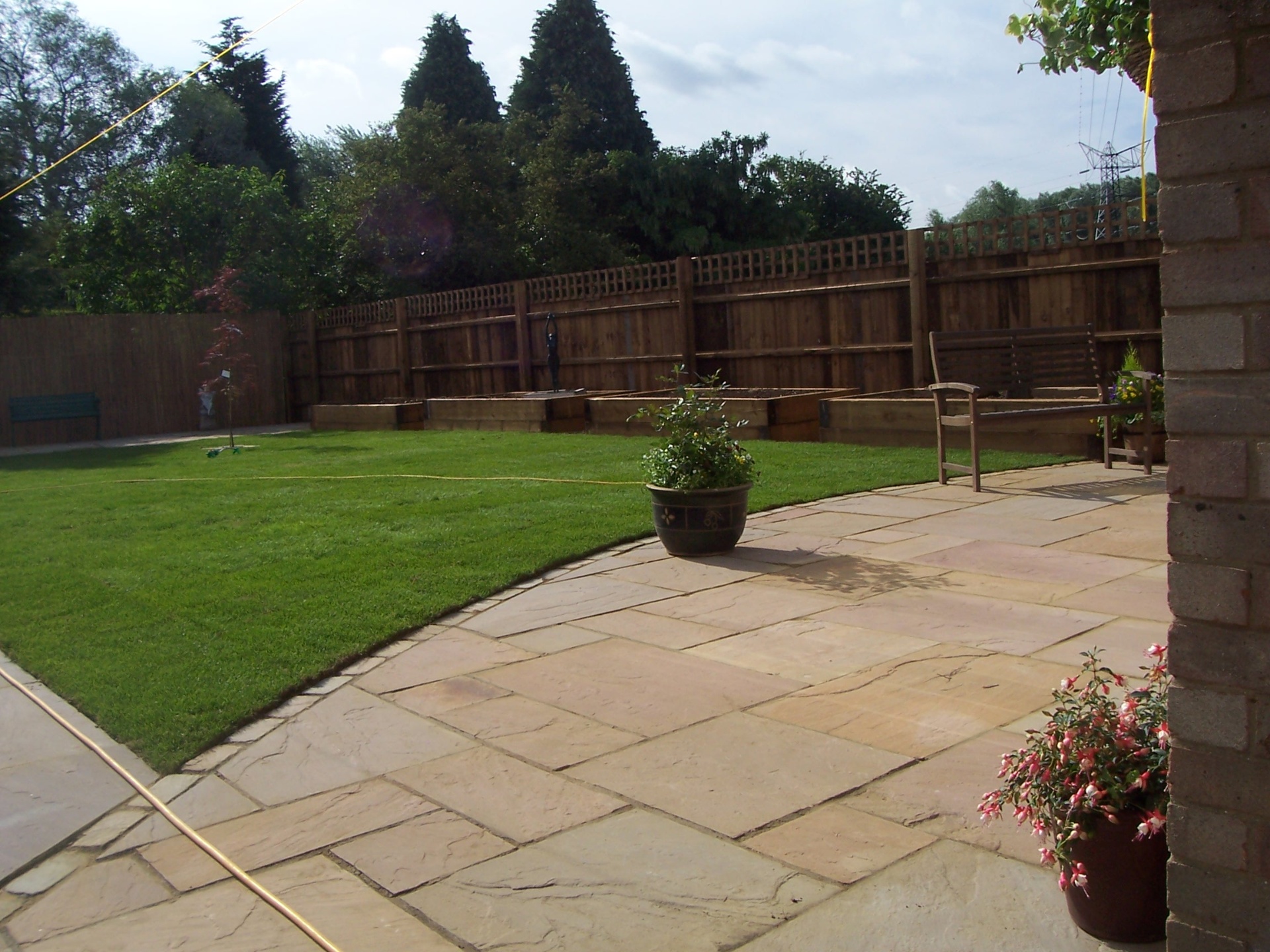 Hard and soft landscaping detail by Boyde Landscaping showing stonework and planting.